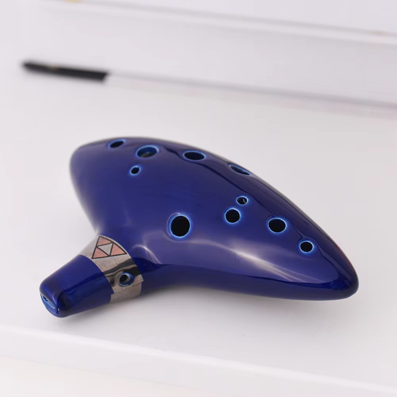 Musical Instrument Book - Ocarina in ceramica a 12 fori