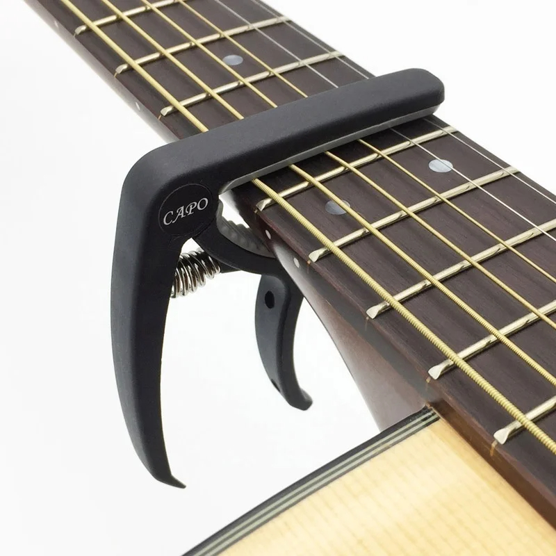 Capotasto per chitarra in plas - Musical Instrument Strings recensione e prezzo